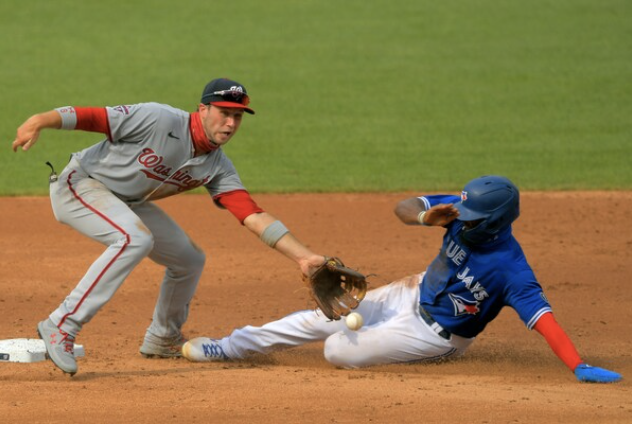 Teoscar Hernandez unsuccessfully slides toward second base on a steal attempt as Washington Nationals Carter Kieboom, playing the shift, gets the tag during the Nationals' defeat of the Toronto Blue Jays, 6-4, at Nationals Park on Thursday, July 30, 2020. MUST CREDIT: Washington Post photo by John McDonnell