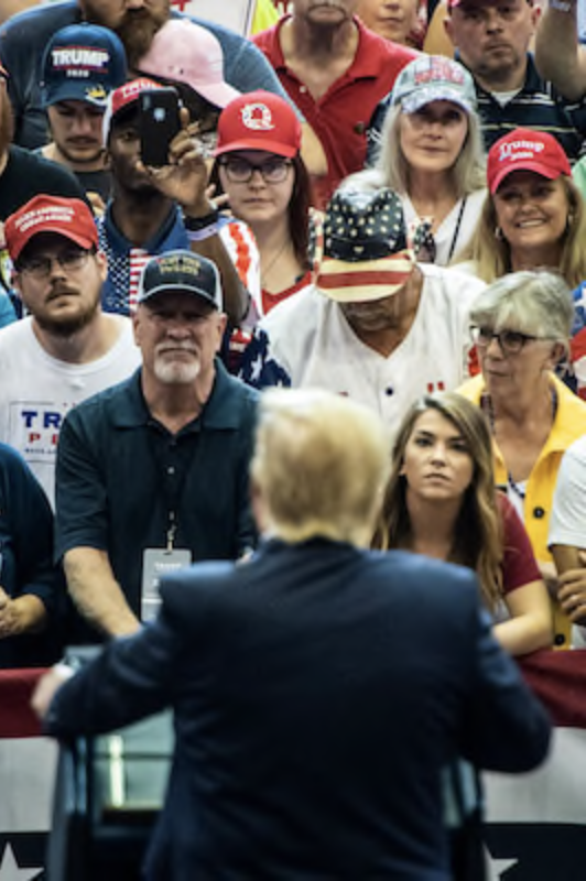 A supporter with a QAnon hat listens as President Donald Trump speaks at a rally in Cincinnati in Aug. 2019. MUST CREDIT: Washington Post photo by Jabin Botsford