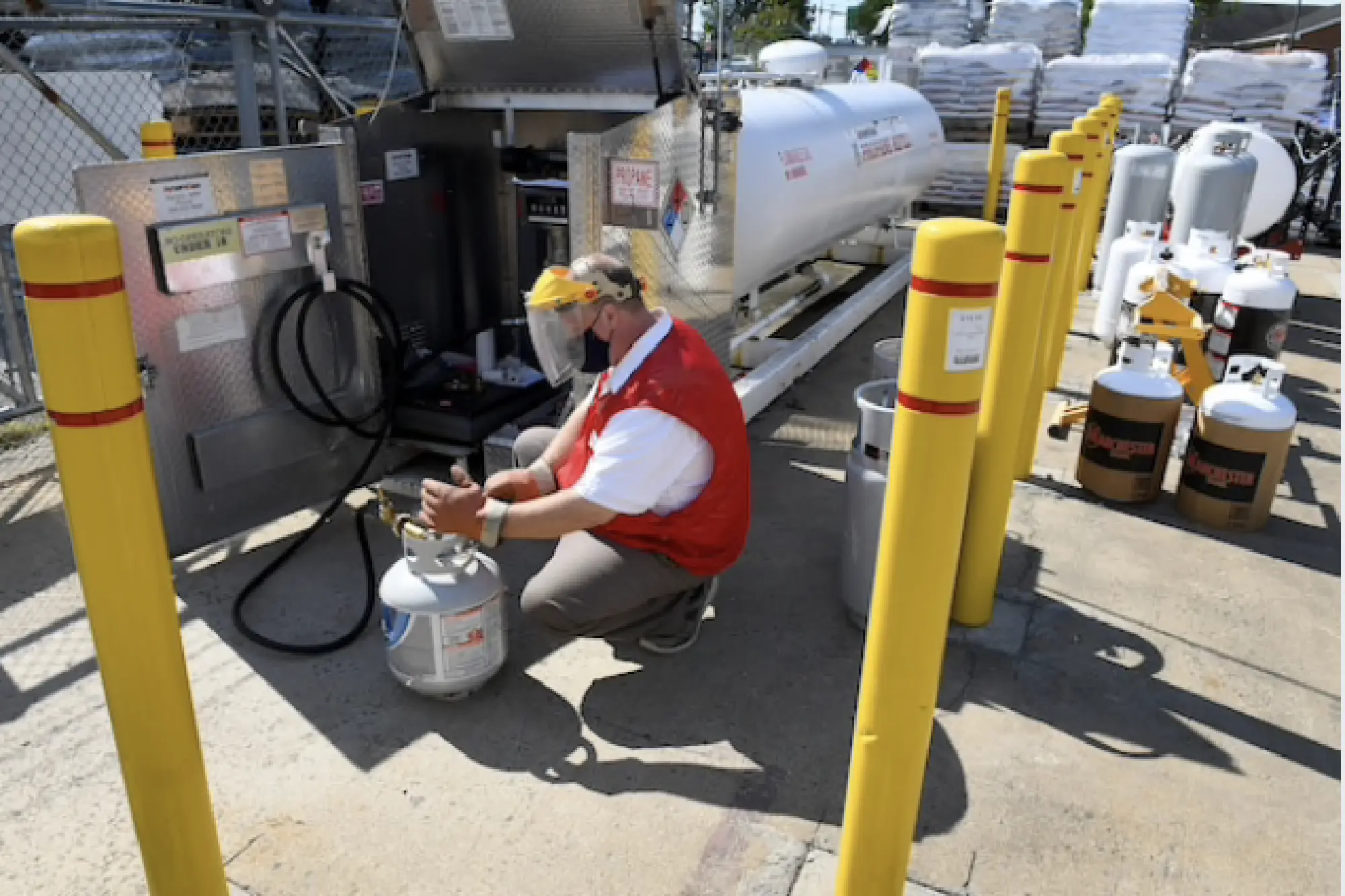 Tim Linch fills a propane tank for a customer at Tractor Supply. CREDIT: Washington Post photo by Katherine Frey.