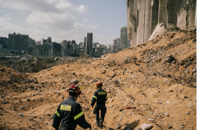 Firefighters and rescue officers from different countries search for missing people on the site of the explosion on Tuesday. MUST CREDIT: Photo by Lorenzo Tugnoli for The Washington Post