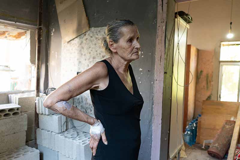 Hayat Abi Chacra, 64, stands in the destroyed room of her son Chadi who died two days after being stuck under the rubble. MUST CREDIT: For The Washington Post by Manu Ferneini