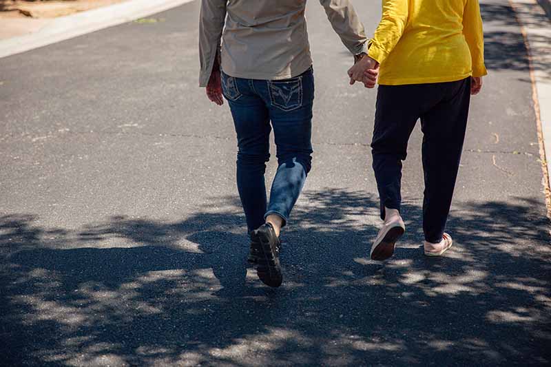 Dena and Rhoda go for a walk around the neighborhood. MUST CREDIT: Photo by Mary Mathis for The Washington Post.
