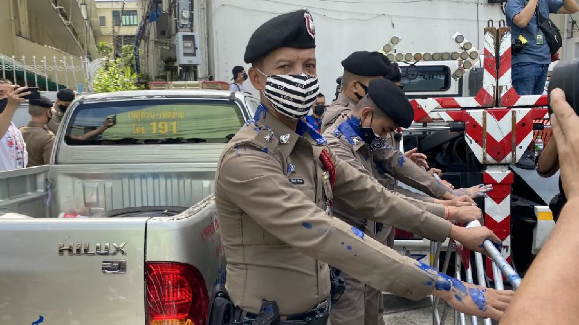 Tension boils over as protest leaders report to police