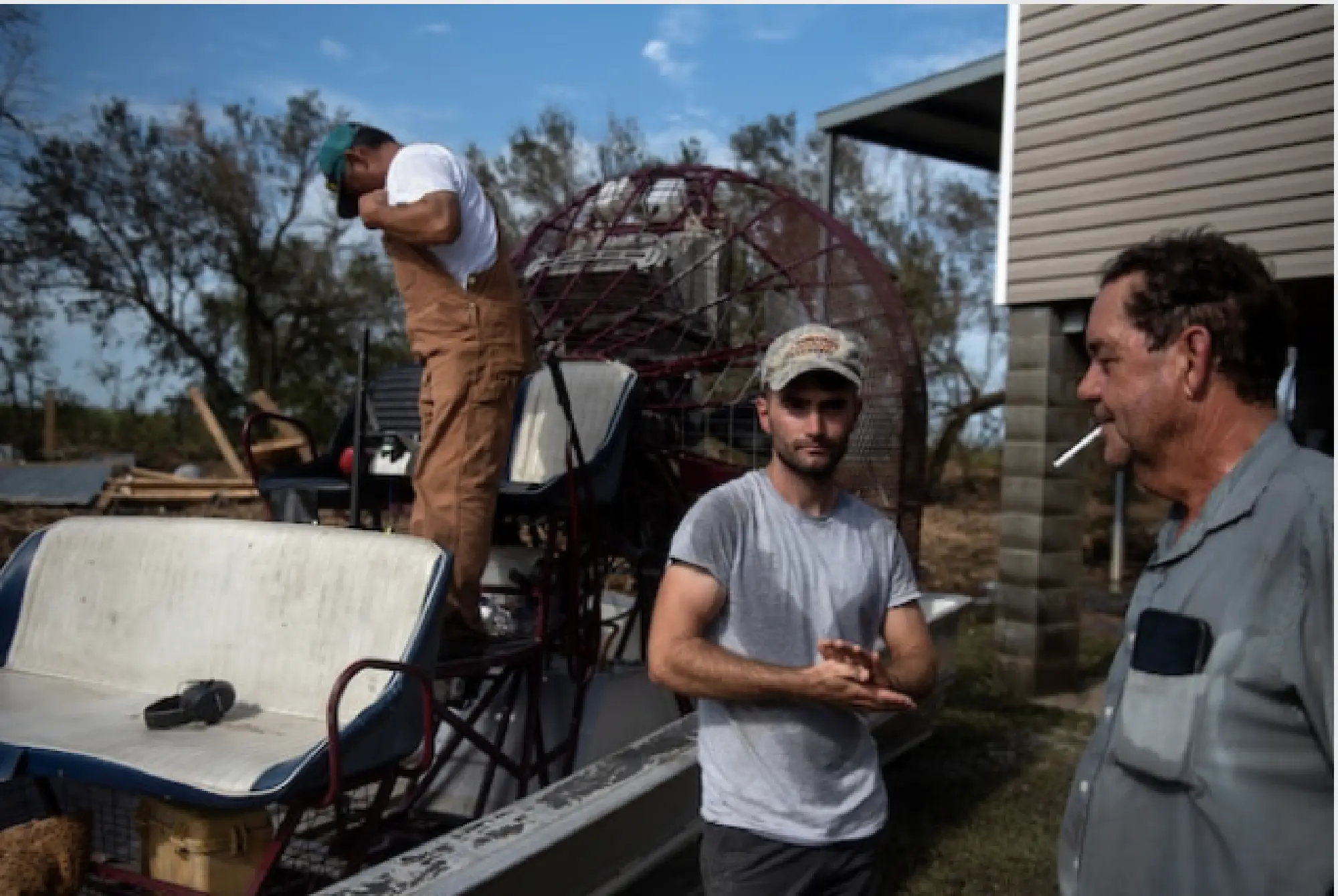 rom left, Tommy Todd, 57, Gabriel Racca, 26, and Mike Trahan, 65, return to their airboat after surveying the damage to Trahan's home from Hurricane Laura in the Little Chenier area of Creole, La. CREDIT: photo for The Washington Post by Callaghan O'Hare.