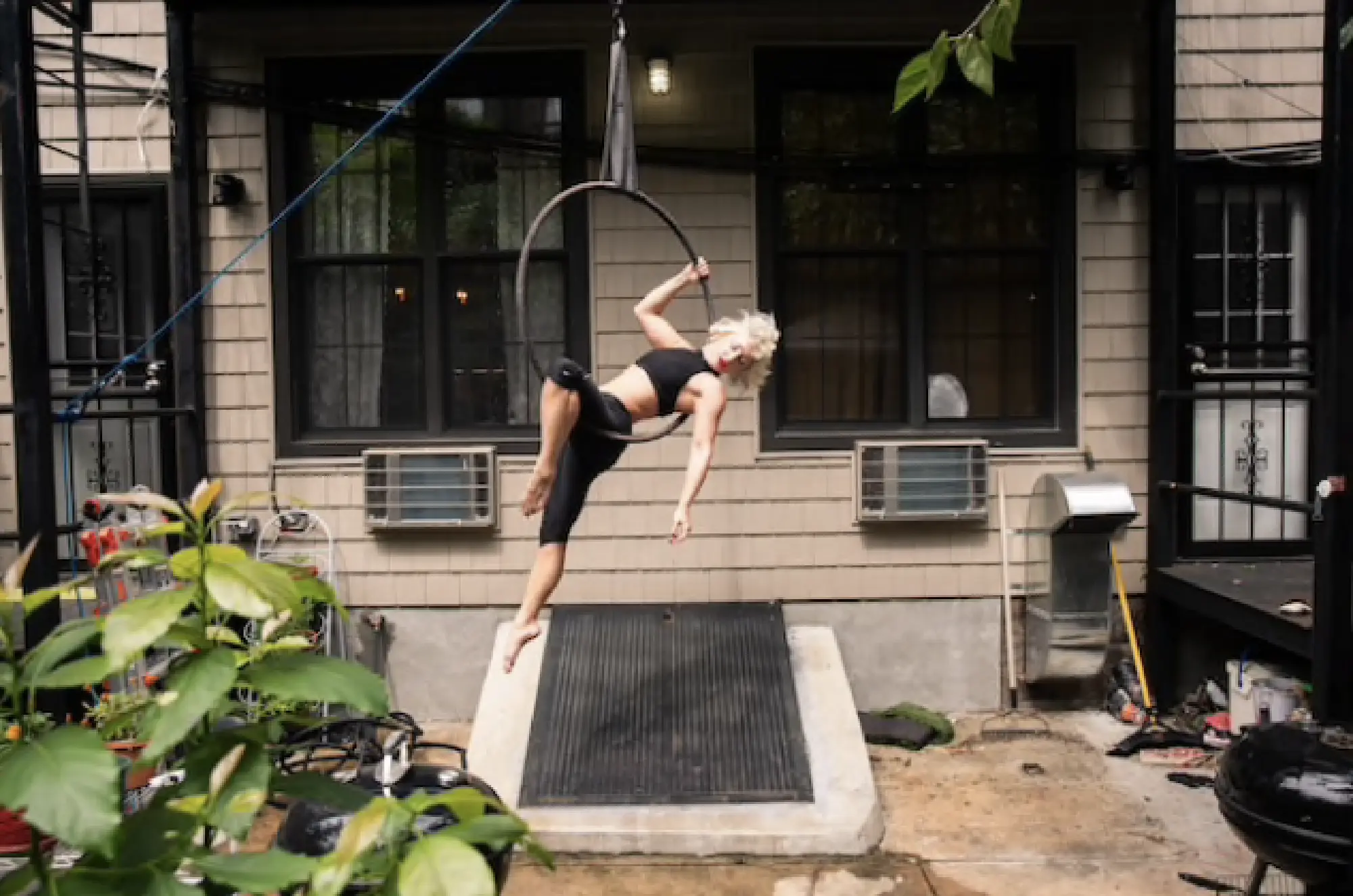An aerialist and opera singer Marcy Richardson practices her Aerialist and opera singer Marcy Richardson practices her aerial hoop act in her Brooklyn backyard. CREDIT: Photo for The Washington Post by Jeenah Moon