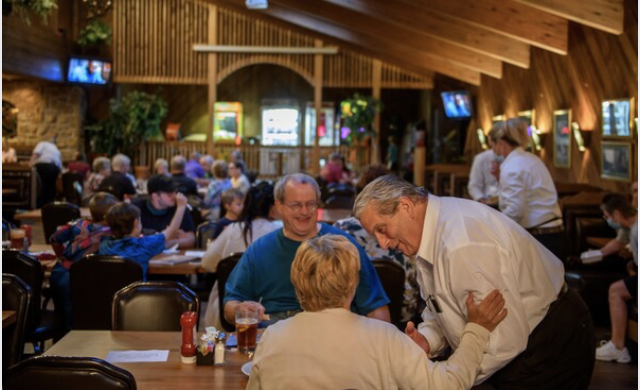 Rpd Ambrogi greets patrons at the restaurant his family has run since 1959.  CREDIT: Photo by Jeff Swensen for The Washington Post