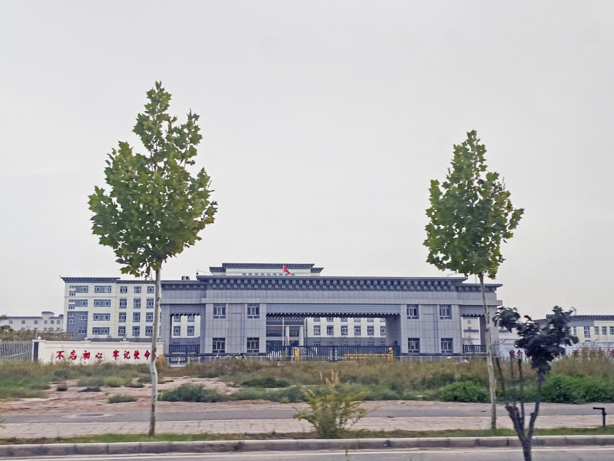 The gate of what is believed to be a new detention camp in Kashgar, China, for Uighur, spanning some 60 acres with 13 five-story buildings that can accommodate more than 10,000 people. Washington Post photo by Anna Fifield