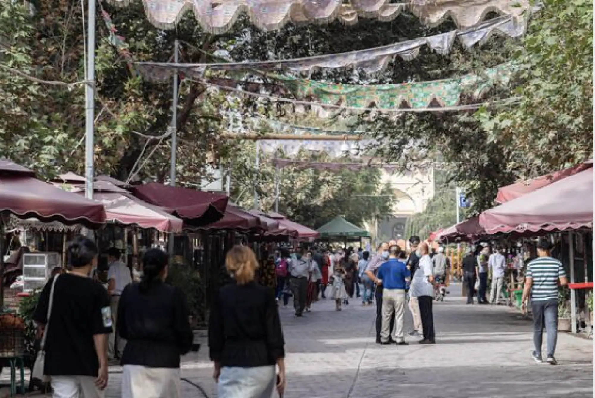 A visitor to Kashgar's Old City might think life looks relatively normal. But a close observer will notice that none of the men in this Muslim center have beards and none of the women wear hijab. MUST CREDIT: Photo for The Washington Post by . Lorenz Huber