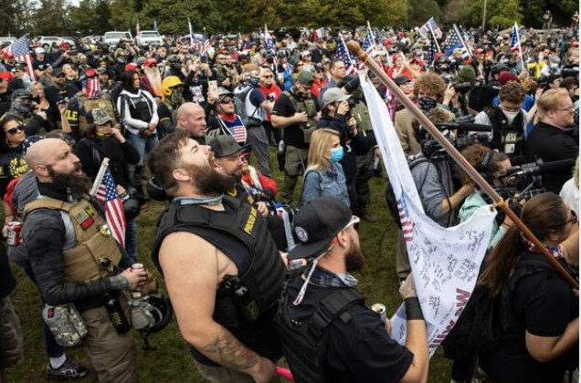 Though organizers expected thousands to convene for the far-right group's gathering in Oregon, the crowd was much smaller. The mostly White, male group rallied in favor of Republicans and President Trump and condemned the state's Democratic governor. Three miles away, antifa and other left-wing groups gathered for a counterprotest of their own, though both demonstrations appeared to be peaceful through the afternoon, much to the relief of city officials. MUST CREDIT: Photo by Paula Bronstein for The Washington Post