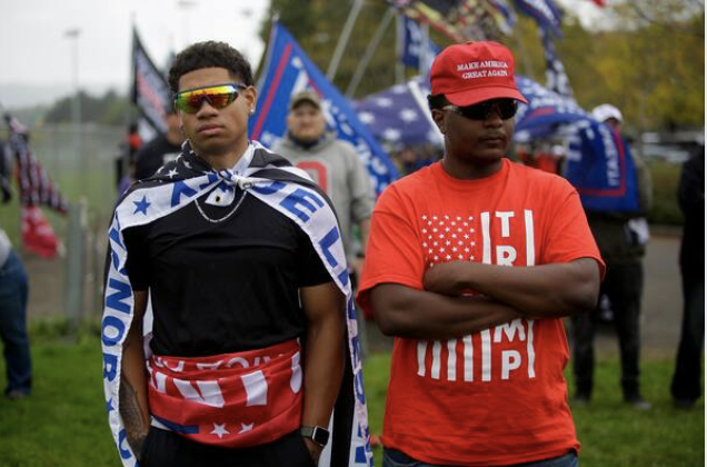 Many attendees explicitly showed their support for Republicans and President Trump with flags and attire, and Trump merchandise was sold in the parking lot. One attendee said the group will back the president should the country "slide into anarchy" in January. MUST CREDIT: Washington Post photo by Joshua Lott