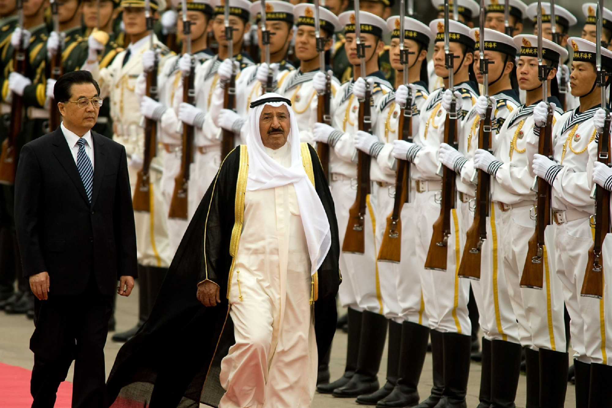 Sheikh Sabah al-Ahmed al-Sabah, Kuwait's emir, center, walks with Chinese President Hu Jintao during a welcoming ceremony outside the Great Hall of the People in Beijing on May 10, 2009. MUST CREDIT: Bloomberg photo by Bernardo De Niz