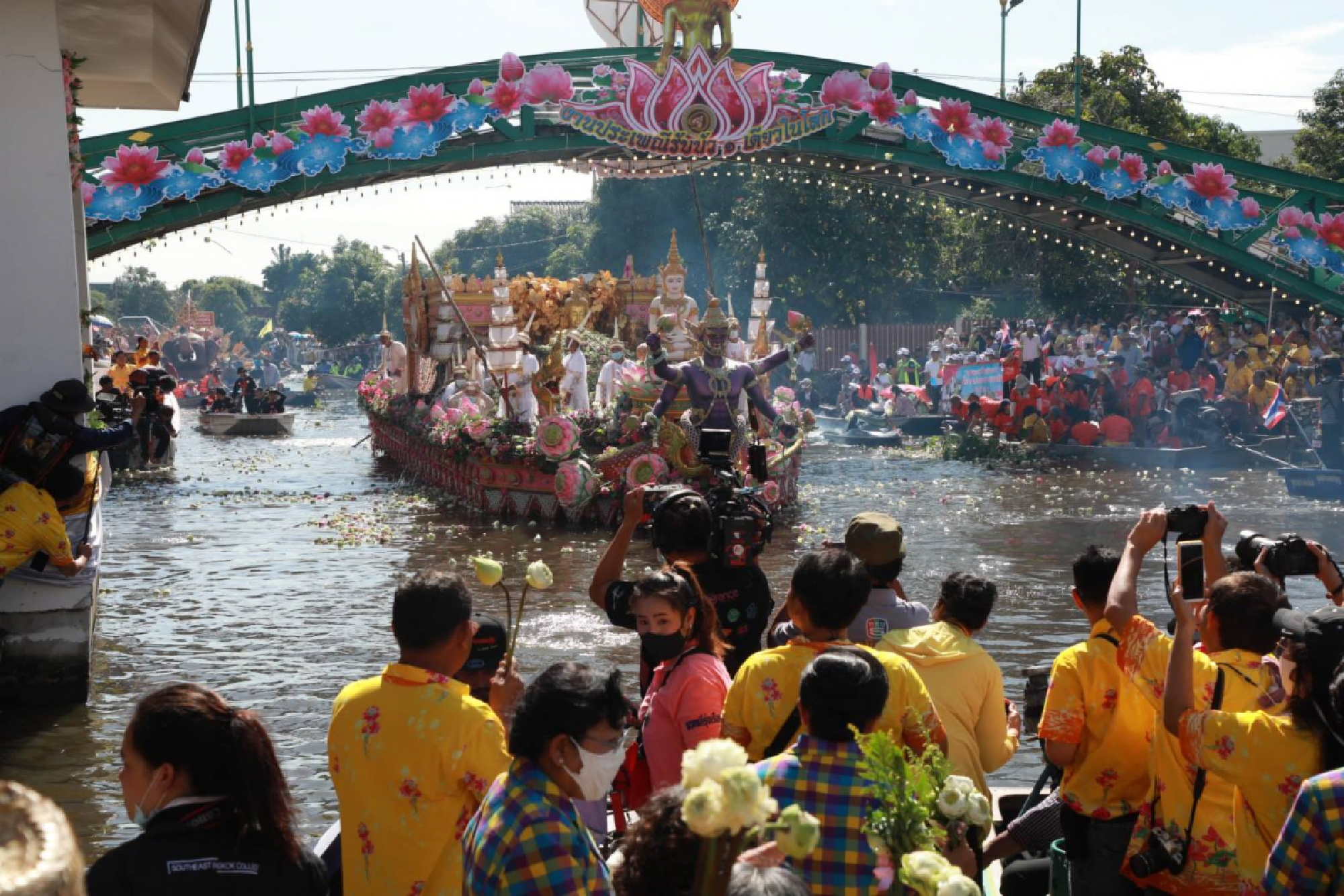 Buddhist devotees come together for lotus-throwing fest despite restrictions