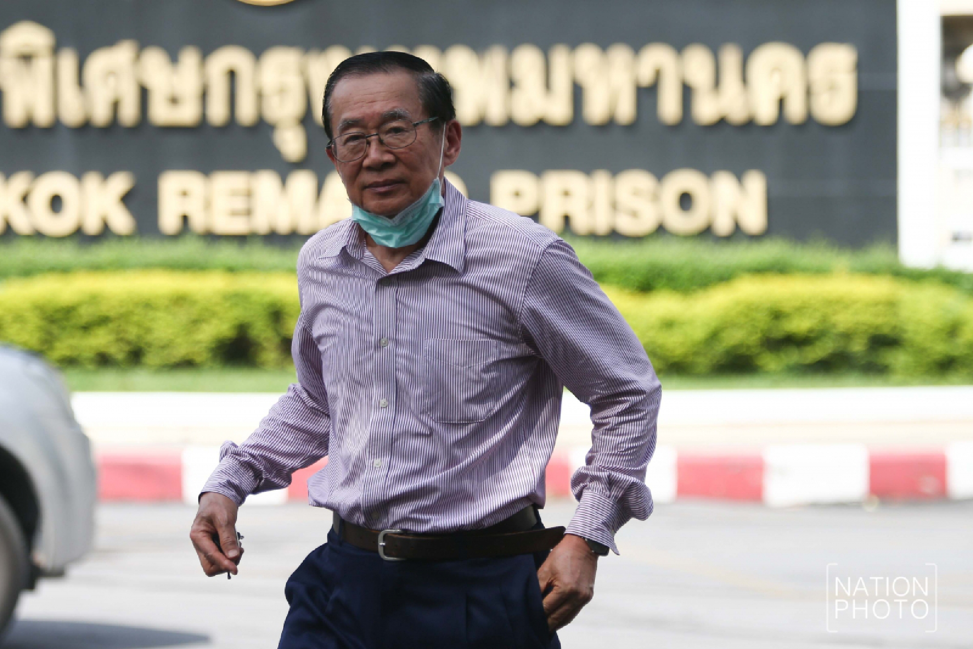 Red shirts greet activists freed from prison after royal pardon