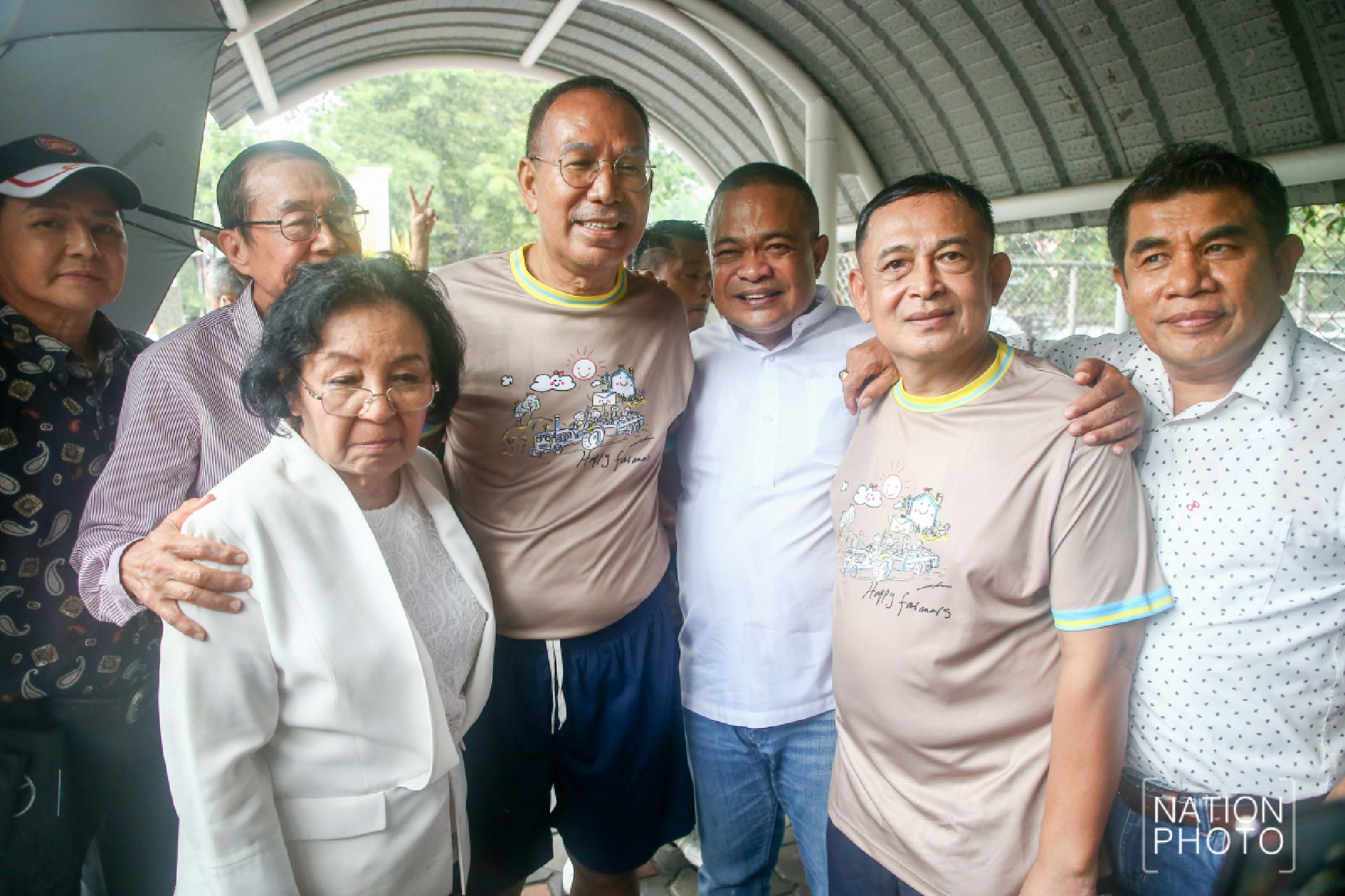 Red shirts greet activists freed from prison after royal pardon