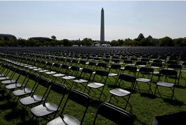 With the White House in the background, 20,000 chairs, each representing 1,000 deaths from the coronavirus pandemic in the United States are lined up on the Ellipse for a remembrance event Sunday, Oct. 4, 2020. MUST CREDIT: Washington Post photo by Katherine Frey