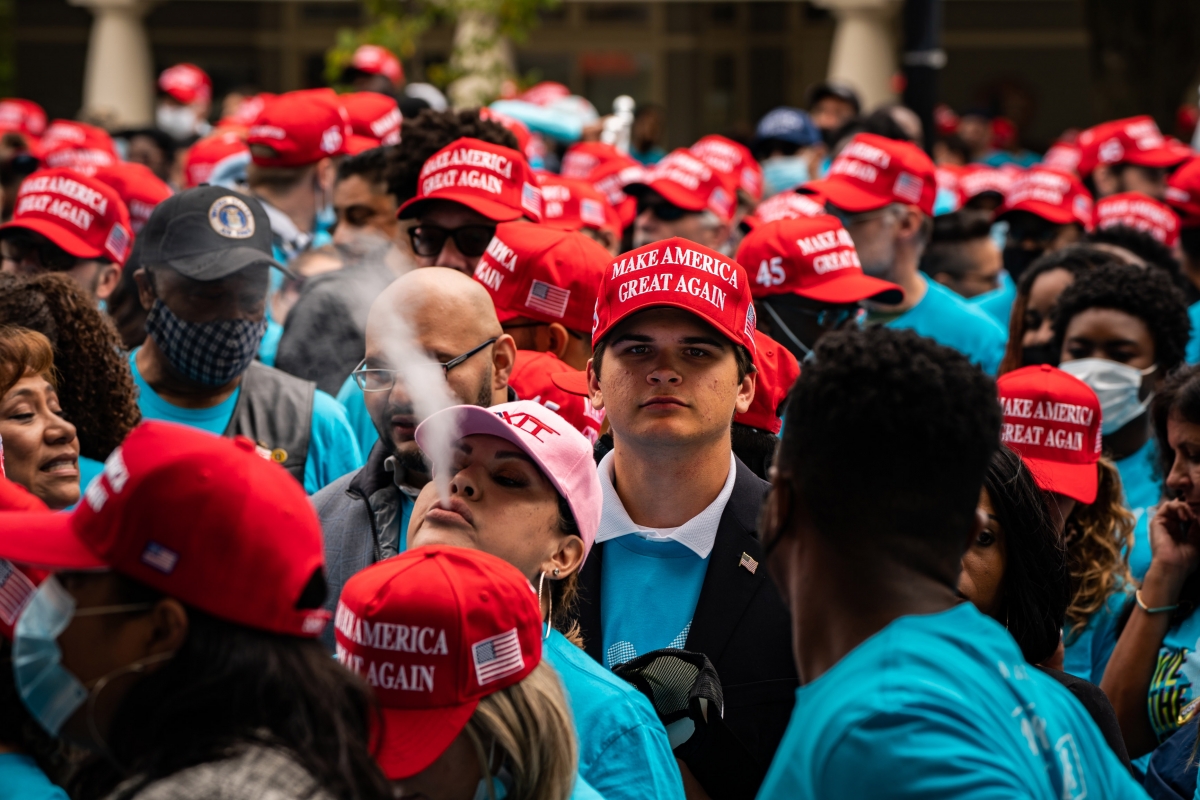 Supporters of President Trump form a line, without socially distancing themselves, outside the White House ahead of an event Saturday. MUST CREDIT: Washington Post photo by Salwan Georges