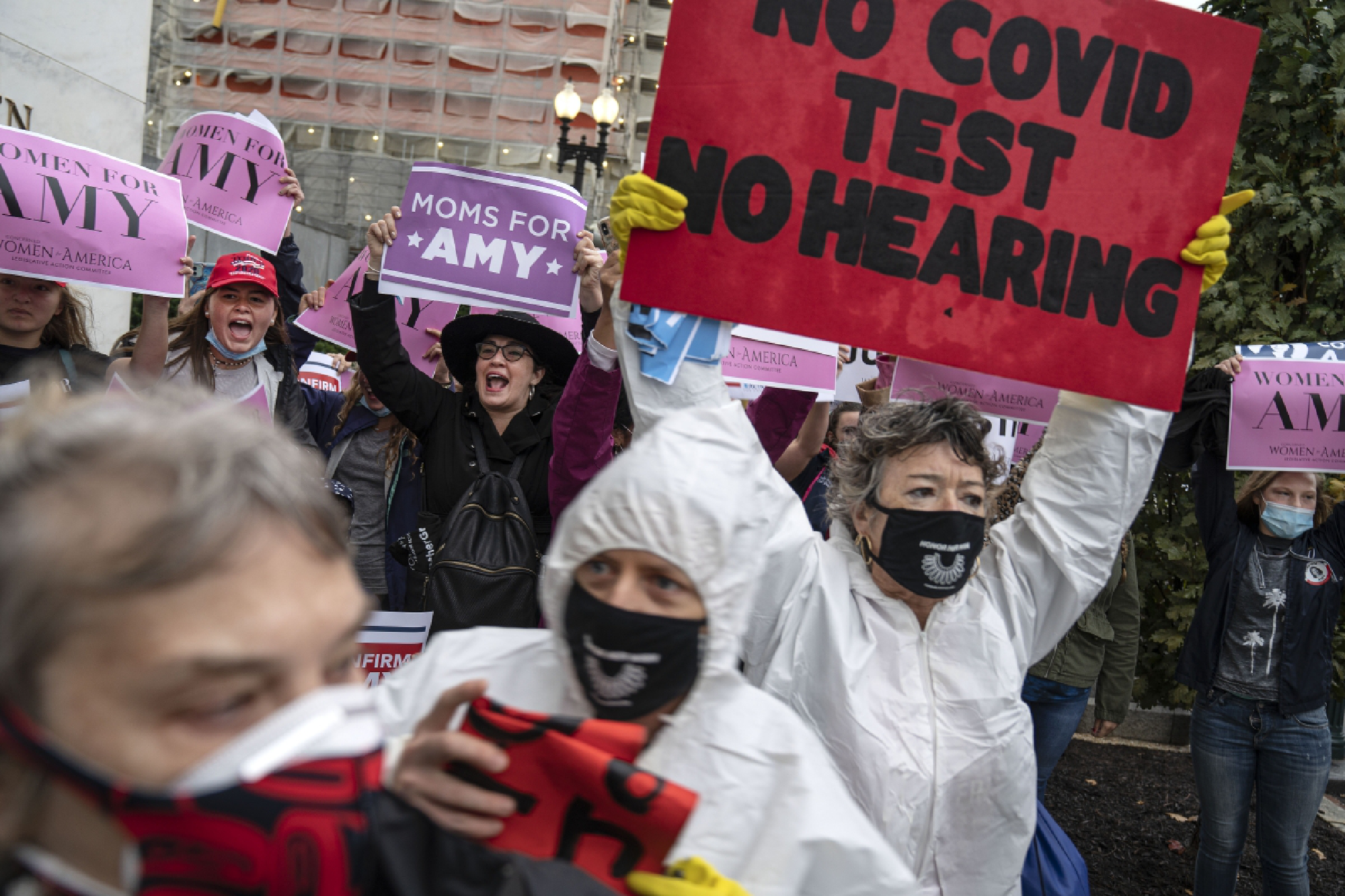 Protesters and supporters of Supreme Court Justice nominee Amy Coney Barrett gather outside the Dirksen Senate Office Building in Washington on Oct. 12, 2020. MUST CREDIT: Washington Post photo by Michael Robinson Chavez