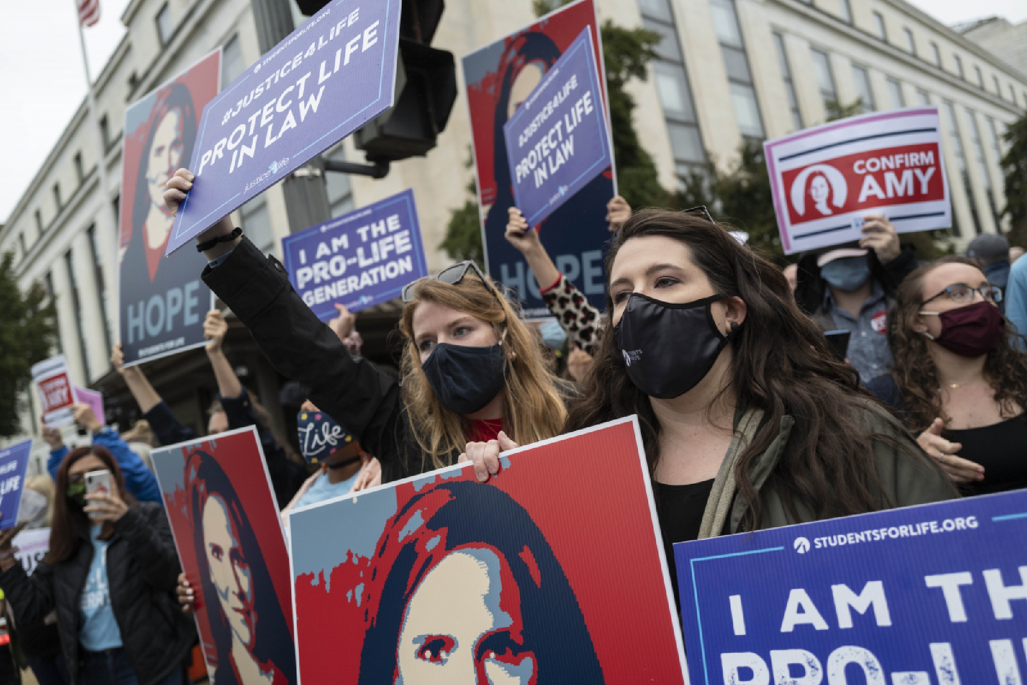Supporters of Supreme Court nominee Amy Coney Barrett gather outside the Dirksen Senate Office Building in Washington. MUST CREDIT: Washington Post photo by