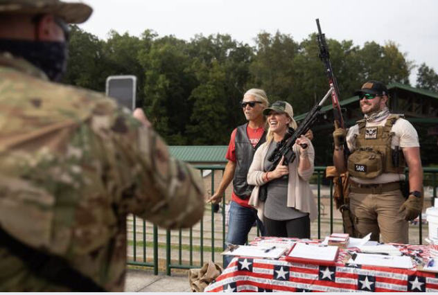 Georgia Republican congressional candidate Marjorie Taylor Greene poses for a photo holding an AR-15 rifle during an event in Ringgold, Ga., on Sept. 19. MUST CREDIT: Photo by Jessica Tezak for The Washington Post