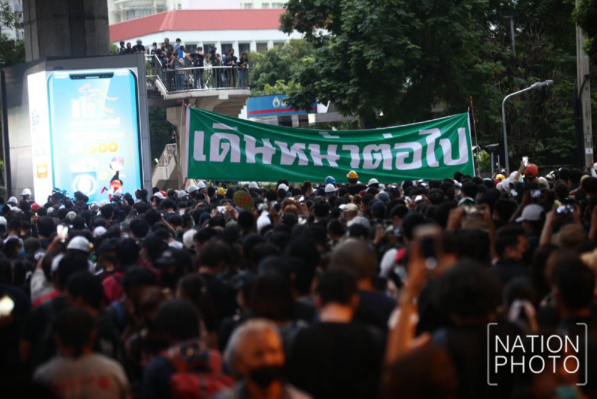 Protesters head to Government House after gathering at Victory Monument