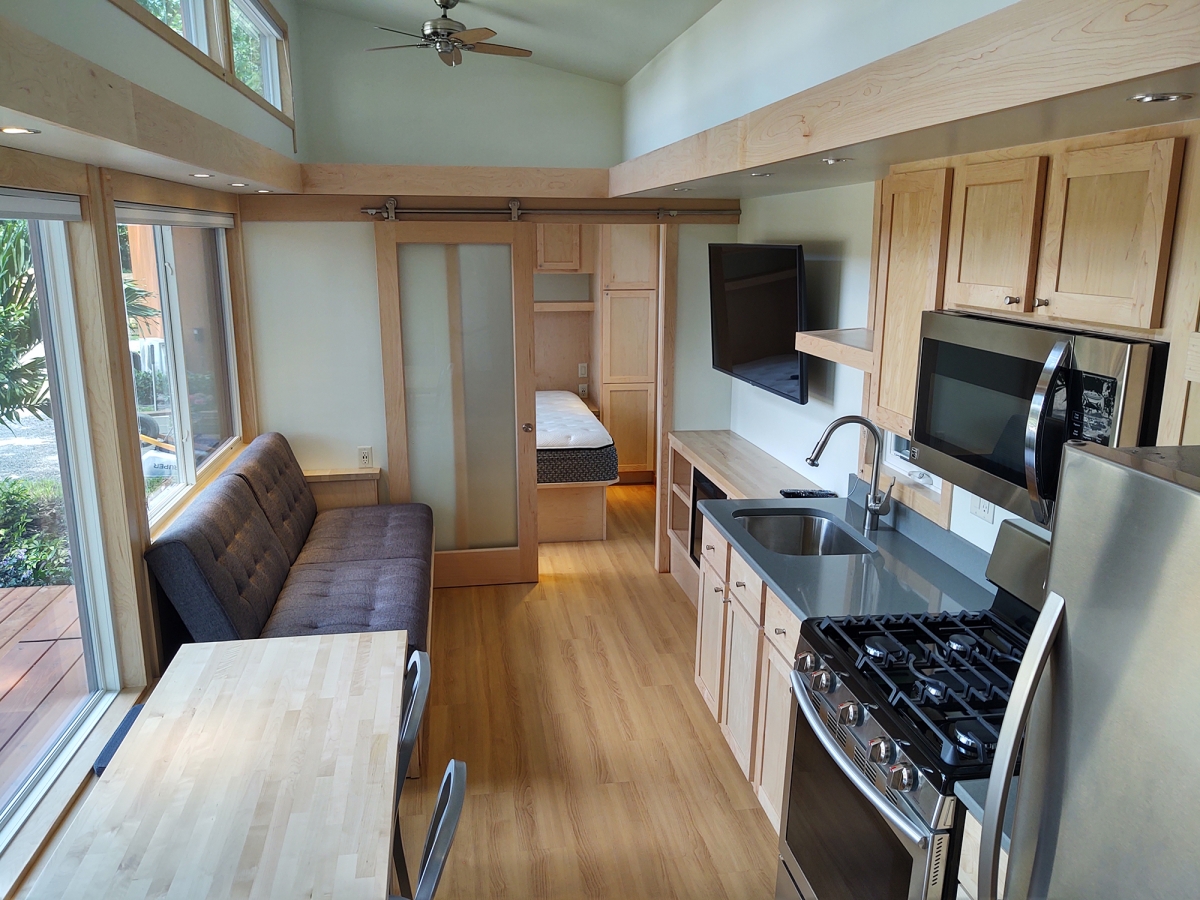 The kitchen in this tiny house in the community has full-size appliances. MUST CREDIT: David Peterson.