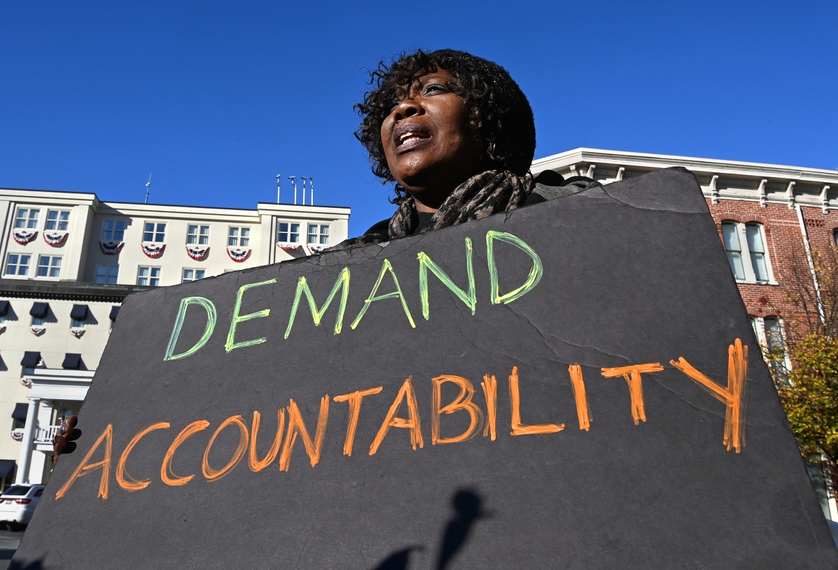 Black Lives Matter protester Irish Whaley holds a sign in the Gettysburg town square. Washington Post photo by Michael S. Williamson.
