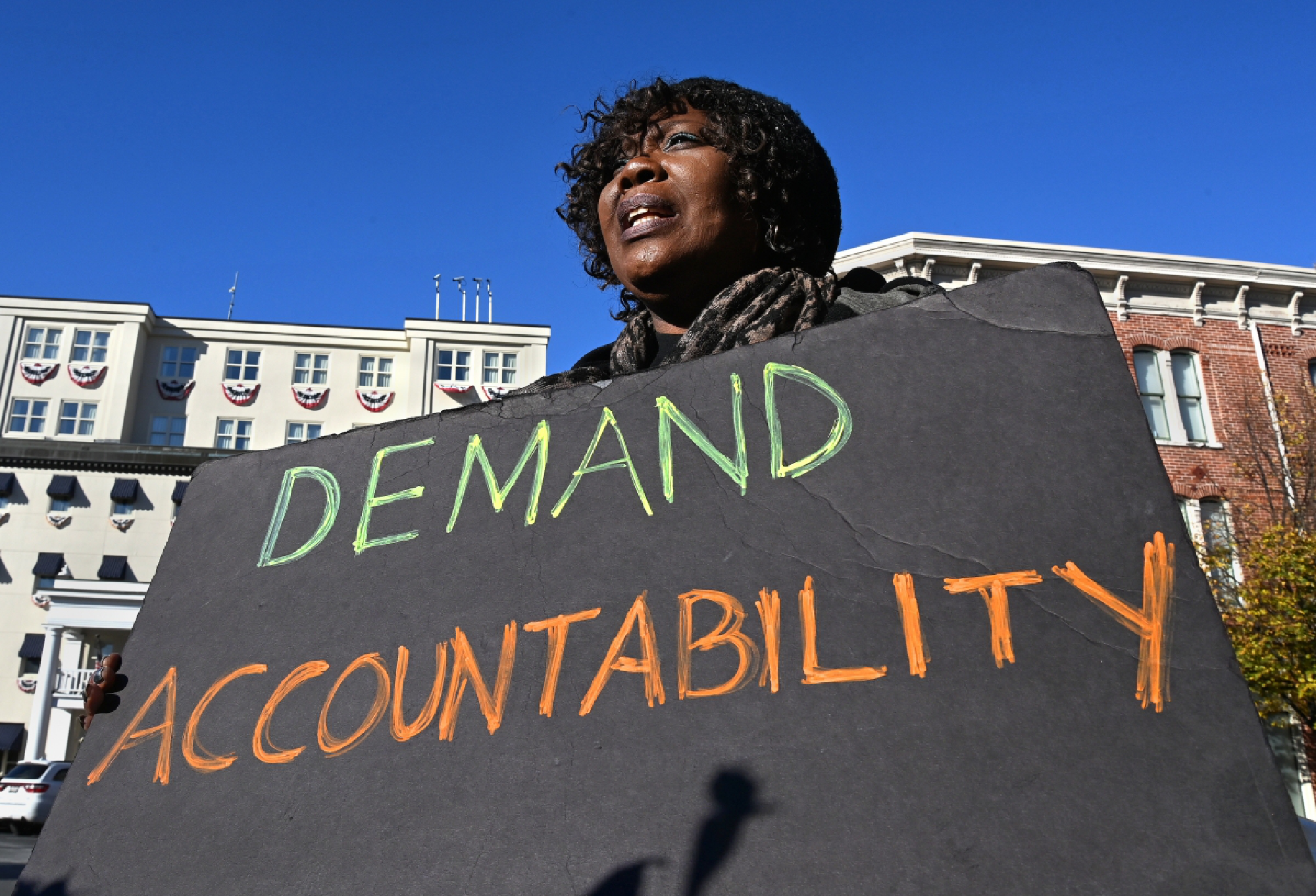 Black Lives Matter protester Irish Whaley holds a sign in the Gettysburg town square. Washington Post photo by Michael S. Williamson.