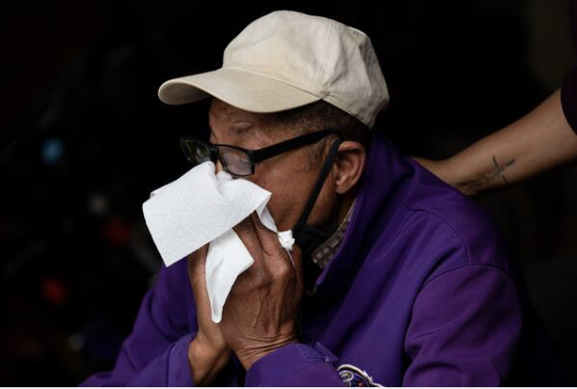 Juanette Long-Coates comforts Ernest Davis, 74, over the loss of Dale, his fiancee. She was "a very jolly person, always smiling," said a former co-worker. MUST CREDIT: Photo by Amanda Andrade-Rhoades for The Washington Post