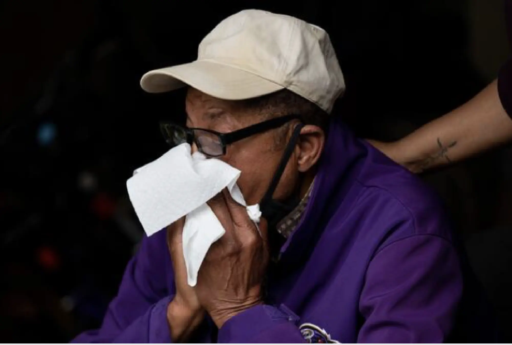 Juanette Long-Coates comforts Ernest Davis, 74, over the loss of Dale, his fiancee. She was "a very jolly person, always smiling," said a former co-worker. MUST CREDIT: Photo by Amanda Andrade-Rhoades for The Washington Post