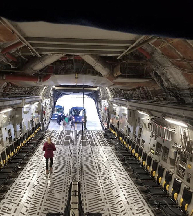 Alexandra Jackson, who joined the West Virginia Air National Guard in 2018, walks inside a C-17 transport plane. MUST CREDIT: Alexandra Jackson.