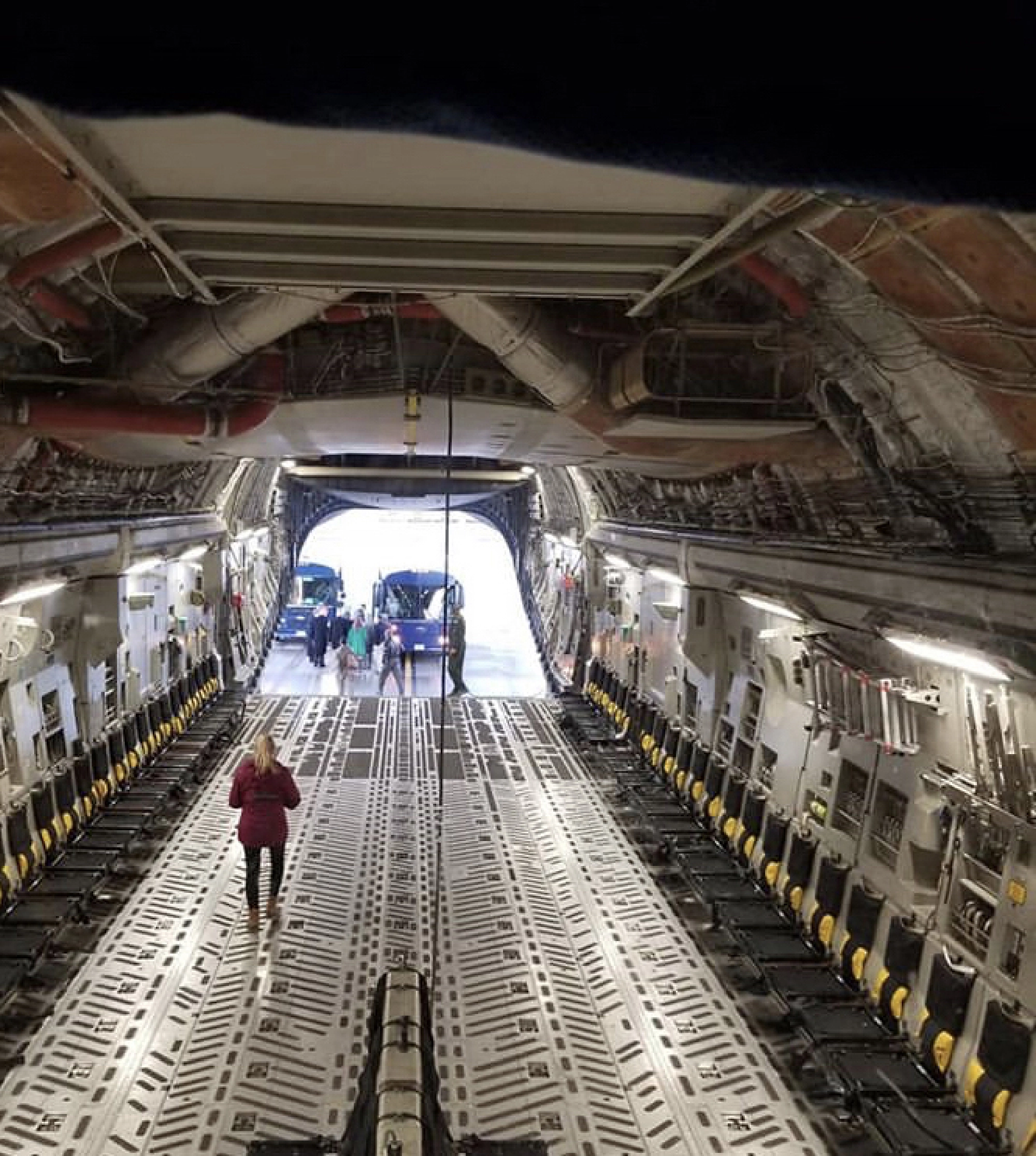 Alexandra Jackson, who joined the West Virginia Air National Guard in 2018, walks inside a C-17 transport plane. MUST CREDIT: Alexandra Jackson.