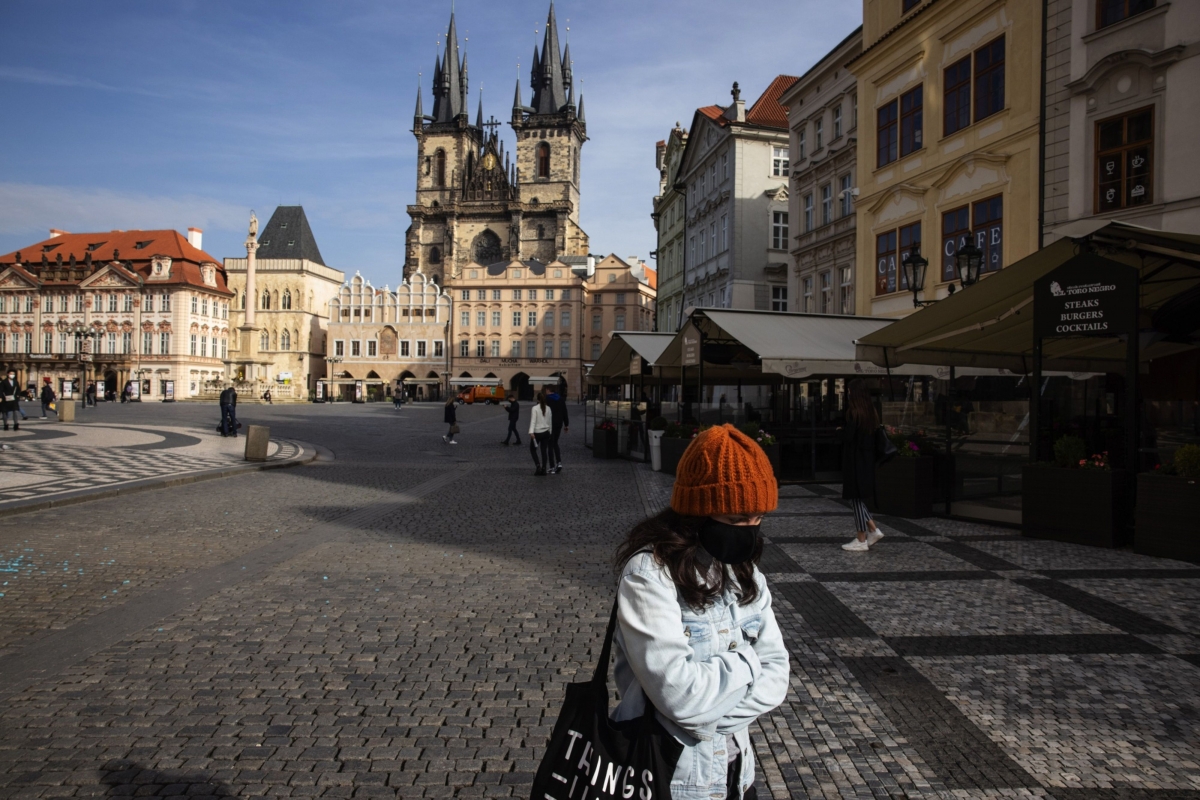 Pedestrians cross the Old Town Square in Prague, Czech Republic, on Oct. 22, 2020. MUST CREDIT: Bloomberg photo by Milan Jaros,