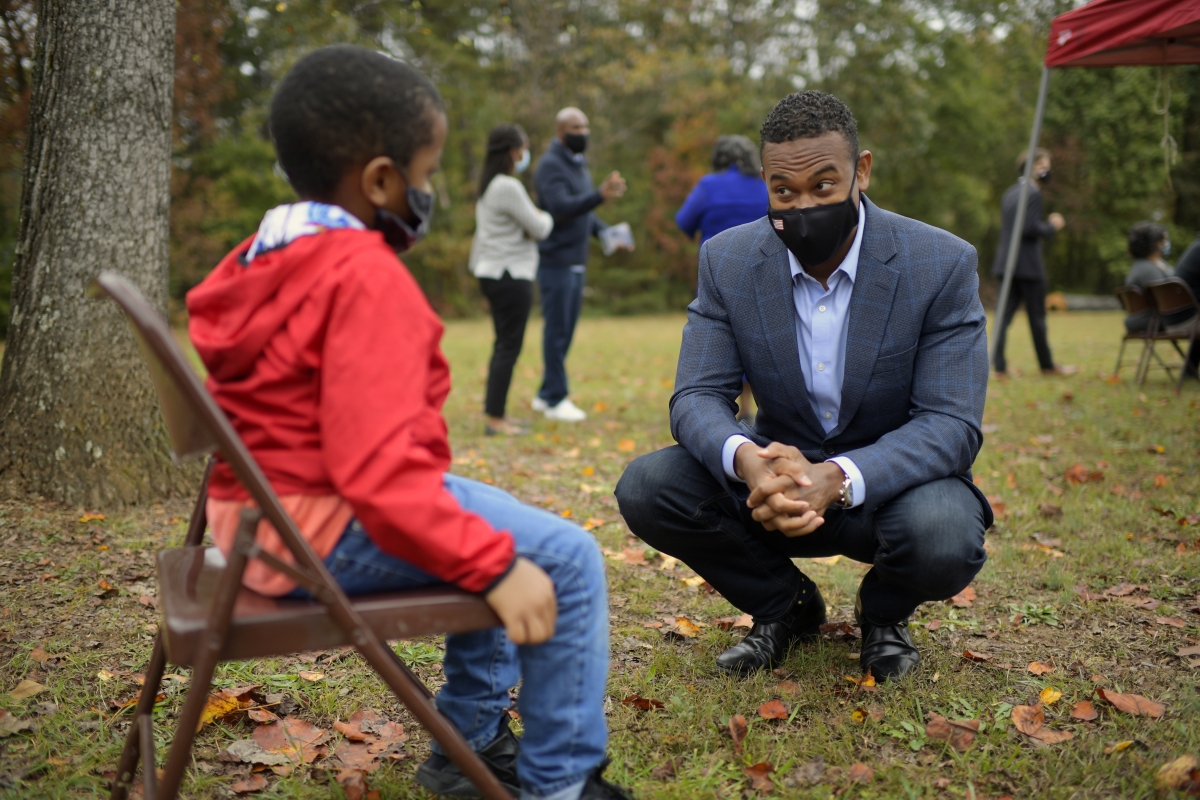 Trenton Green, 5, talks with Democrat Cameron Webb at an event in New Canton, Va., on Oct. 27. MUST CREDIT: Washington Post photo by John McDonnell.