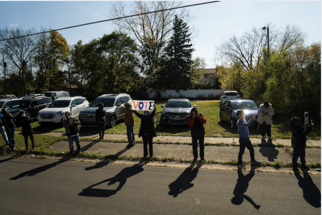 Supporters line the route of Joe Biden's motorcade through Flint, Mich., on Saturday. MUST CREDIT: Washington Post photo by Demetrius Freeman Photo by: Demetrius Freeman — The Washington Post Location: Washington United States