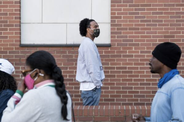 Michael Scott waits in line to vote at his alma mater North Carolina Central University. MUST CREDIT: Photo for The Washington Post by Cornell Watson