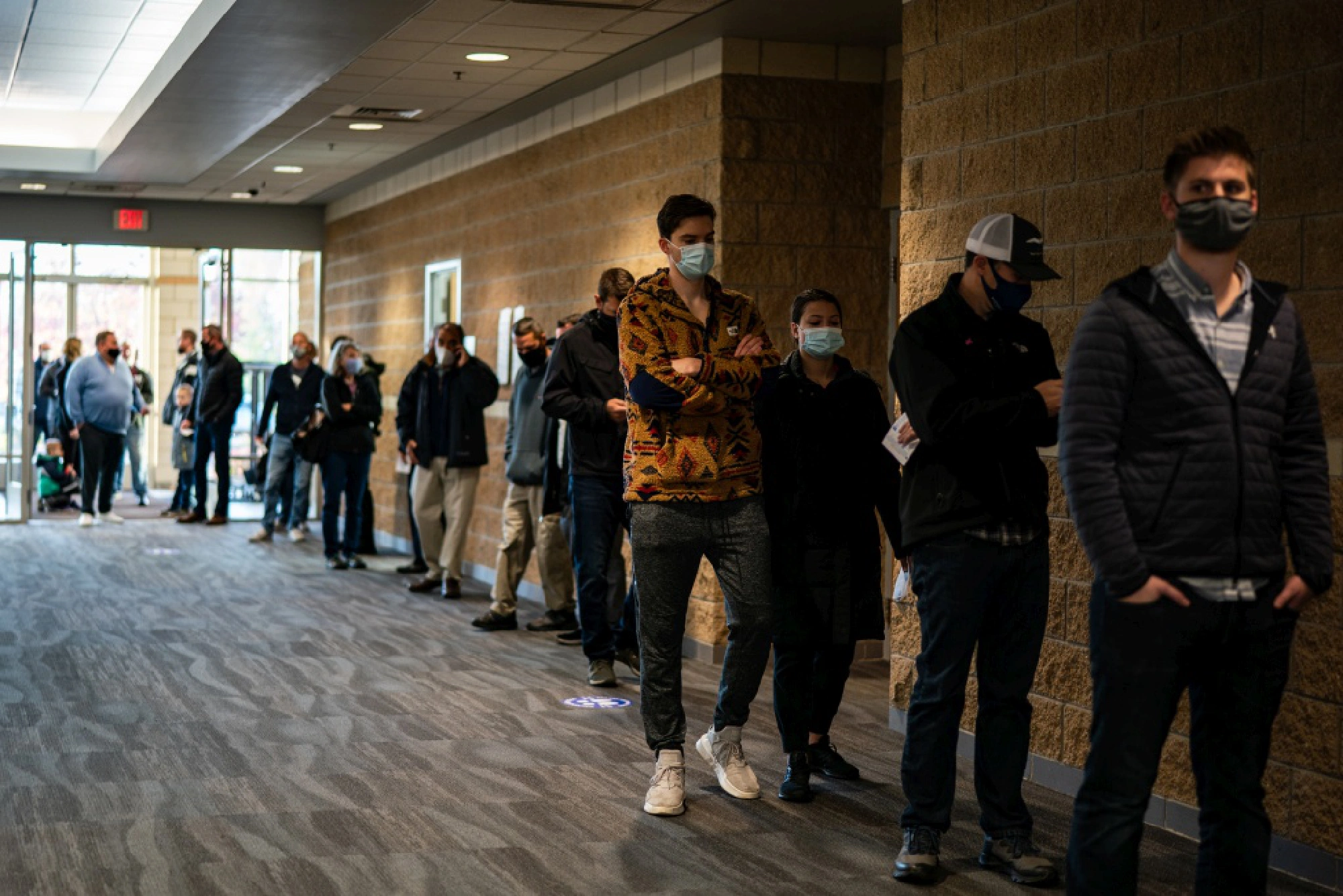 Voters wait in line at a polling location inside Ada Bible Church in Ada, Mich., on Tuesday. MUST CREDIT: Washington Post photo by Salwan Georges/ Photo by: Salwan Georges — The Washington Post Location: Ada, United States
