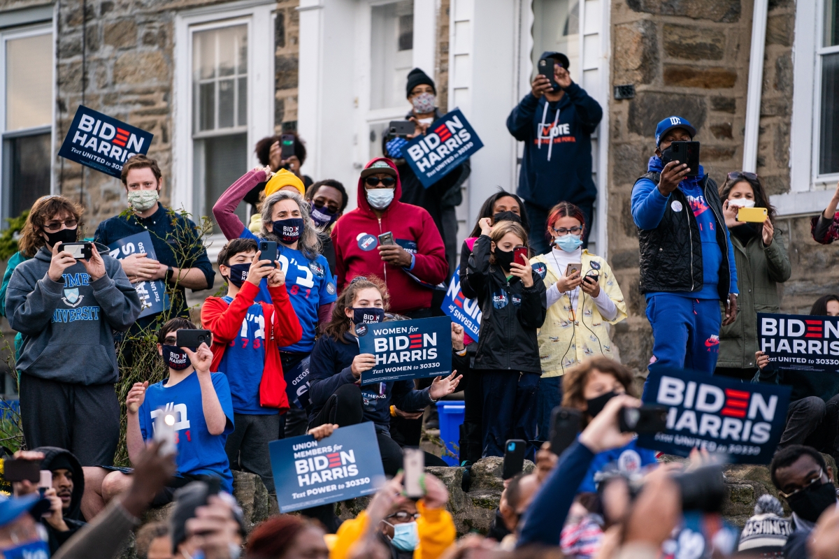 Supporters listen to former vice president Joe Biden at a campaign stop in the West Oak Lane neighborhood of Philadelphia on Tuesday, Nov., 3, 2020. MUST CREDIT: Washington Post photo by Demetrius Freeman