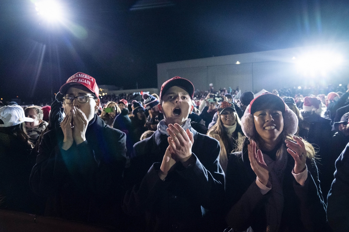 Supporters cheer as President Donald Trump speaks during a rally at Gerald R. Ford International Airport in Grand Rapids, Mich., early Tuesday, Nov. 3, 2020. MUST CREDIT: Washington Post photo by Jabin Botsford