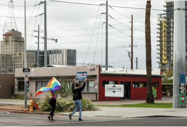 Biden supporters celebrate on Sunday in Phoenix. MUST CREDIT: Photo for The Washington Post by Caitlin O'Hara