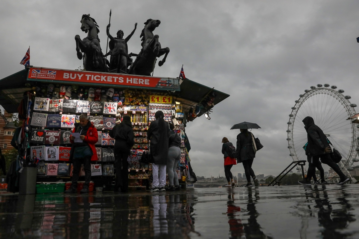 Pedestrians pass a tourist souvenir stall on Westminster Bridge in London on Aug. 27, 2020. MUST CREDIT: Bloomberg photo by Simon Dawson