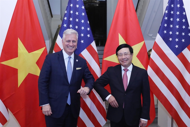 Vietnamese Deputy Prime Minister and Foreign Minister Phạm Bình Minh (right) did an elbow greeting with the US National Security Advisor Robert O’Brien in Hà Nội on Saturday. — VNA/VNS Photo Lâm Khánh