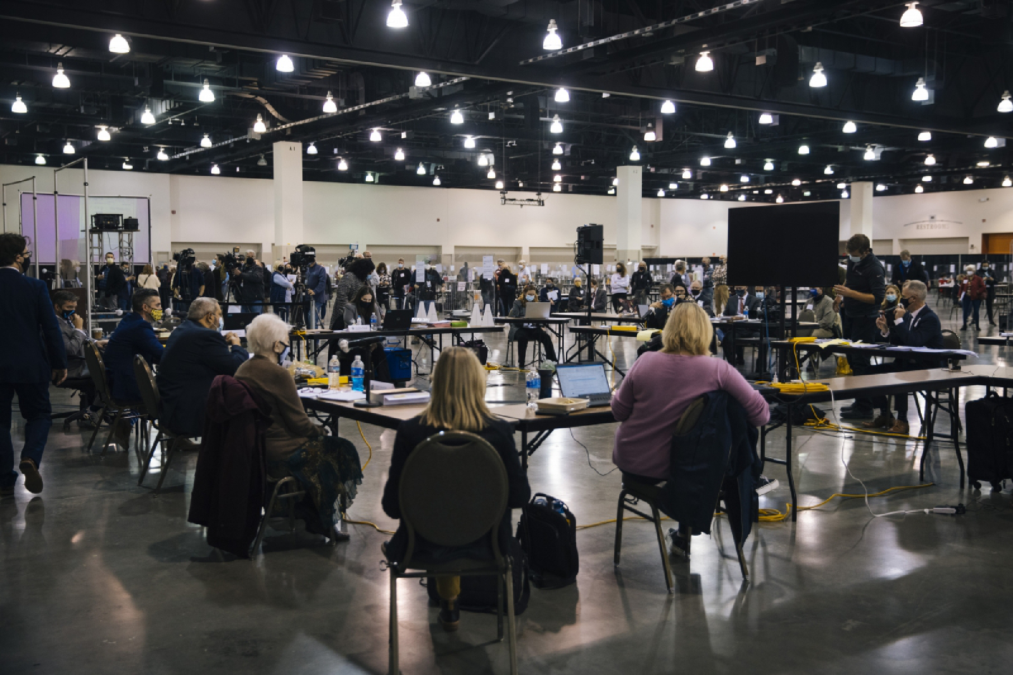 Counting at the Wisconsin Center in Milwaukee was temporarily put on hold Friday after objections from President Donald Trump's team about the distance of legal observers. MUST CREDIT: Photo for The Washington Post by Taylor Glascock