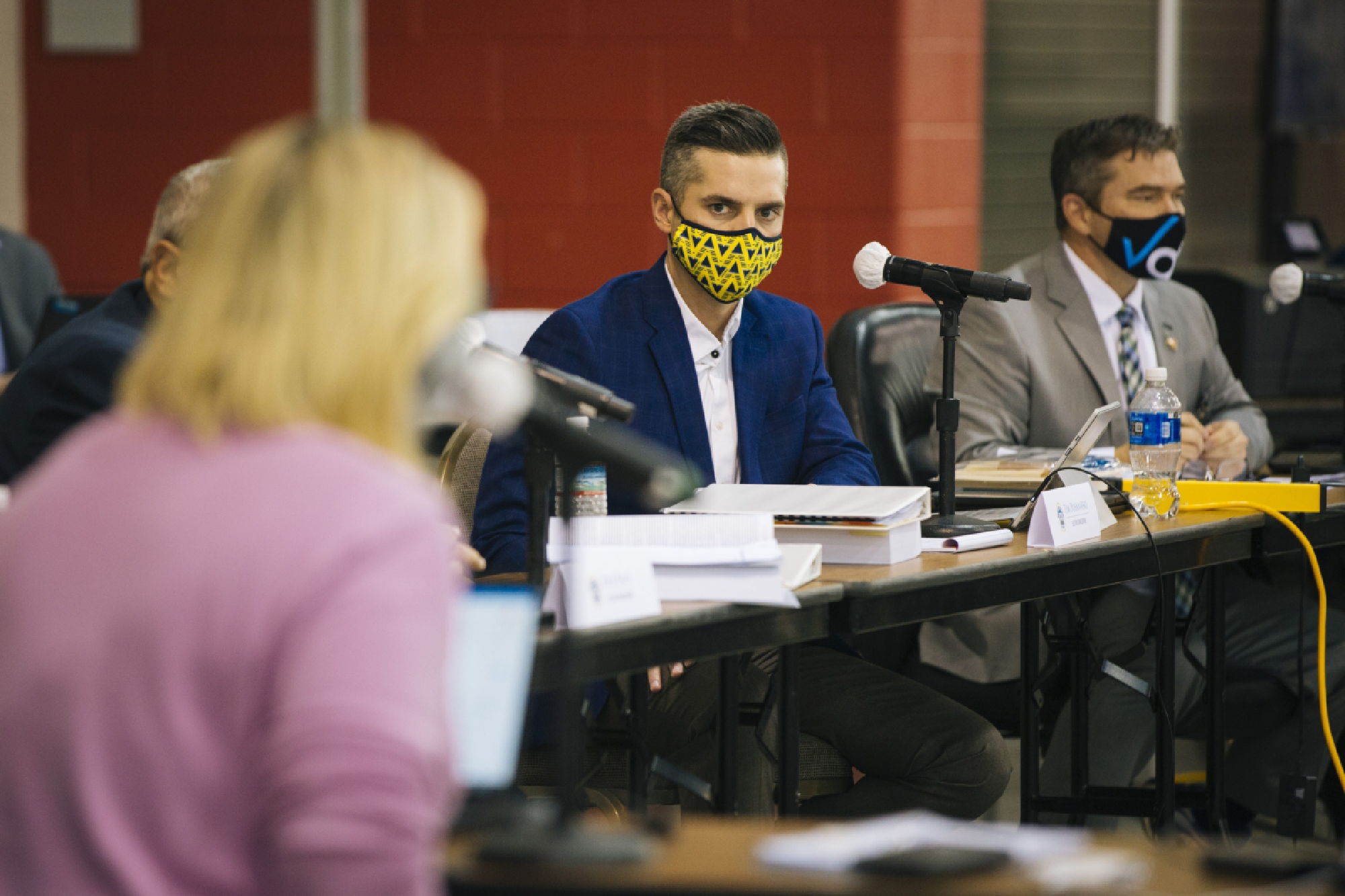Milwaukee Election Commissioner Tim Posnanski, center, listens to a question during recount proceedings. MUST CREDIT: Photo for The Washington Post by Taylor Glascock