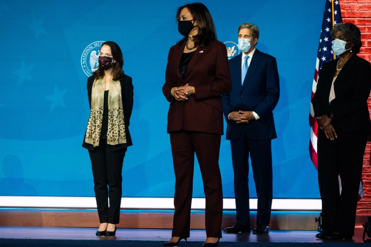Vice President-elect Kamala D. Harris, center, appears onstage as President-elect Joe Biden introduces nominees for his administration on Tuesday. So far his picks have underscored his conciliatory posture. MUST CREDIT: Washington Post photo by Demetrius Freeman