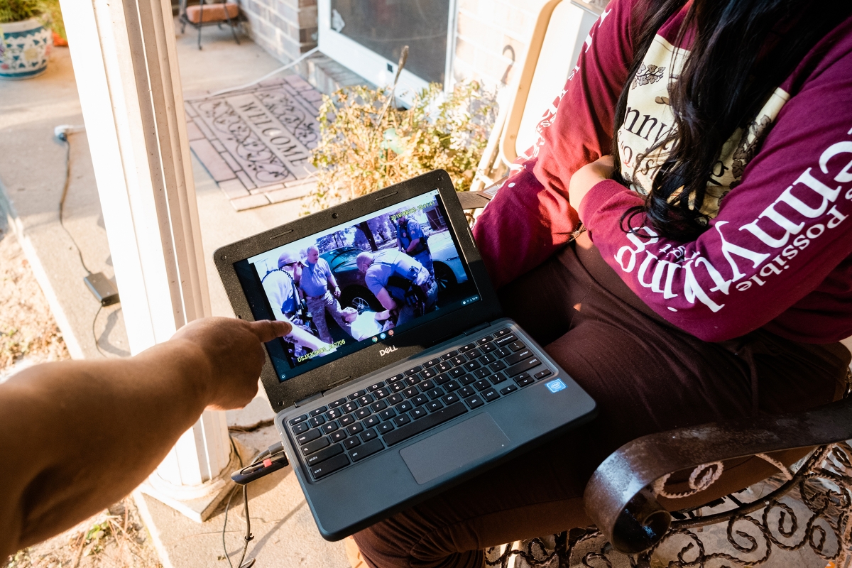 Juanita Fitts points to body-cam footage of the 2018 K-9 attack on her son that is now at the center of a civil lawsuit against the department. MUST CREDIT: Photo for The Washington Post by Cameron Carnes