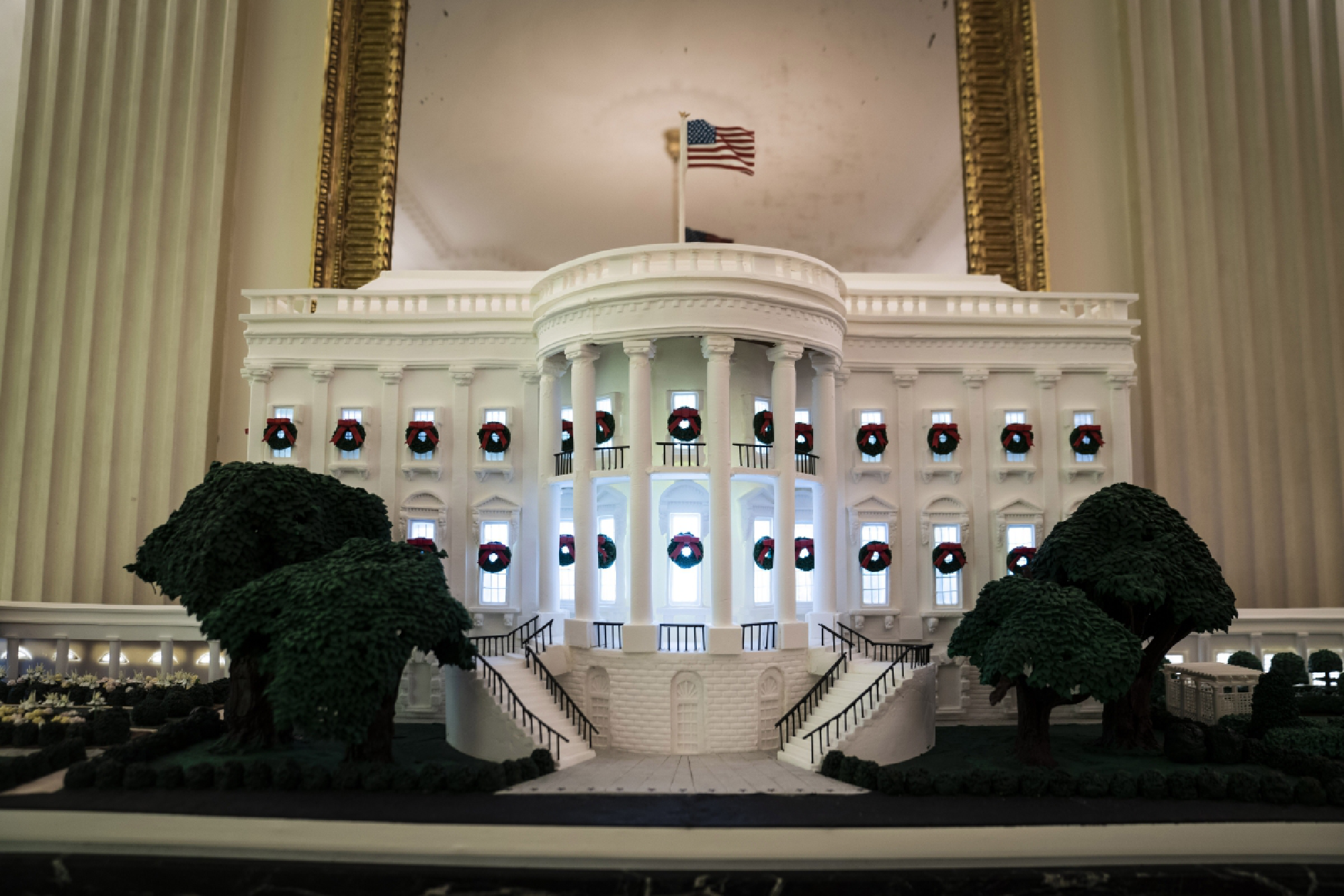The 2020 gingerbread house displayed in the State Dining Room depicts the West Wing, Executive Residence and, for the first time, the Rose Garden and First Ladies' Garden. The pastry team used 275 pounds of gingerbread dough, 110 pounds of pastillage dough, 30 pounds of gum paste, 25 pounds of chocolate and 25 pounds of royal icing. MUST CREDIT: Washington Post photo by Jabin Botsford.