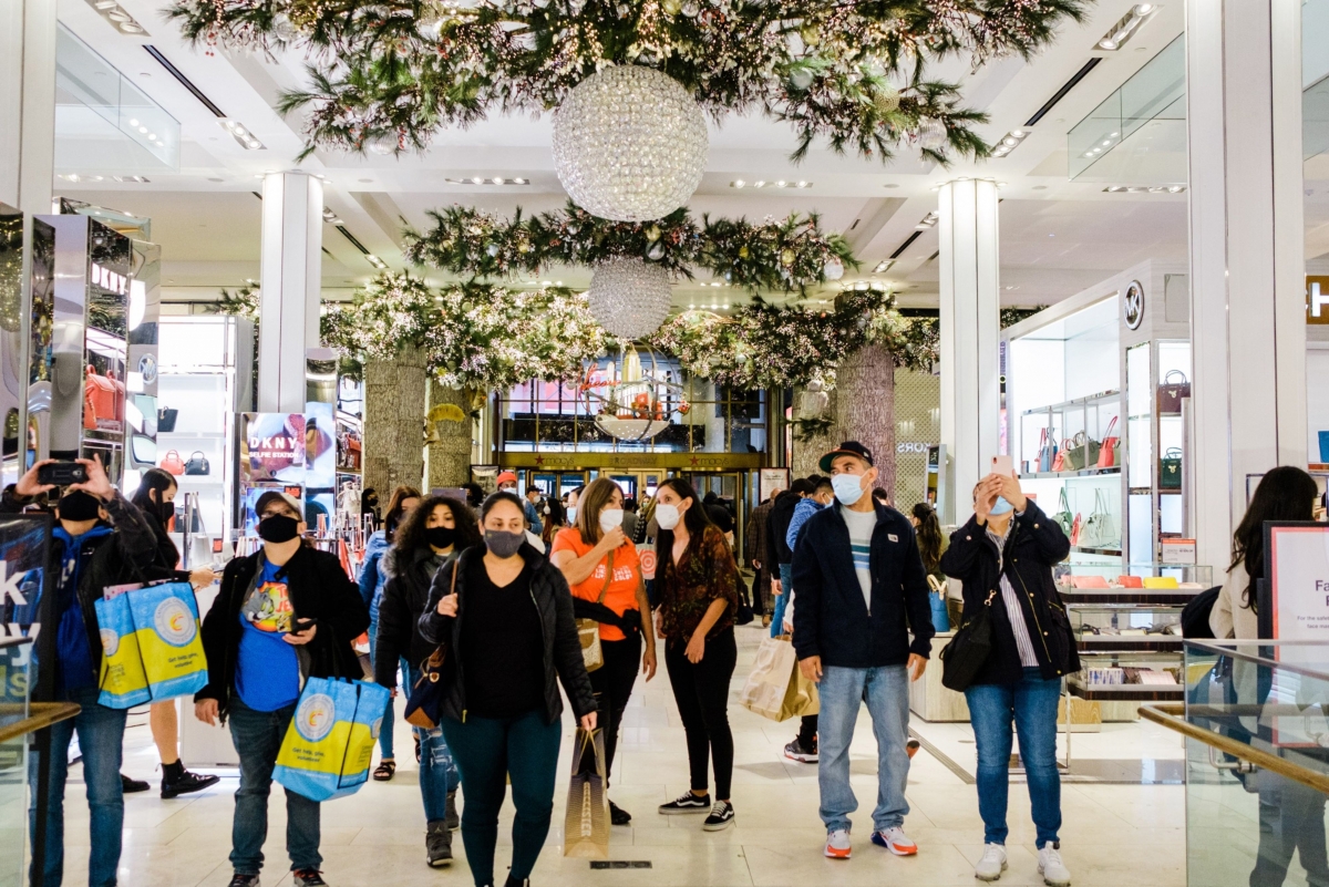 Shoppers walk through Macy's flagship store in New York, on Nov. 27. MUST CREDIT: Bloomberg photo by Gabriela Bhaskar.