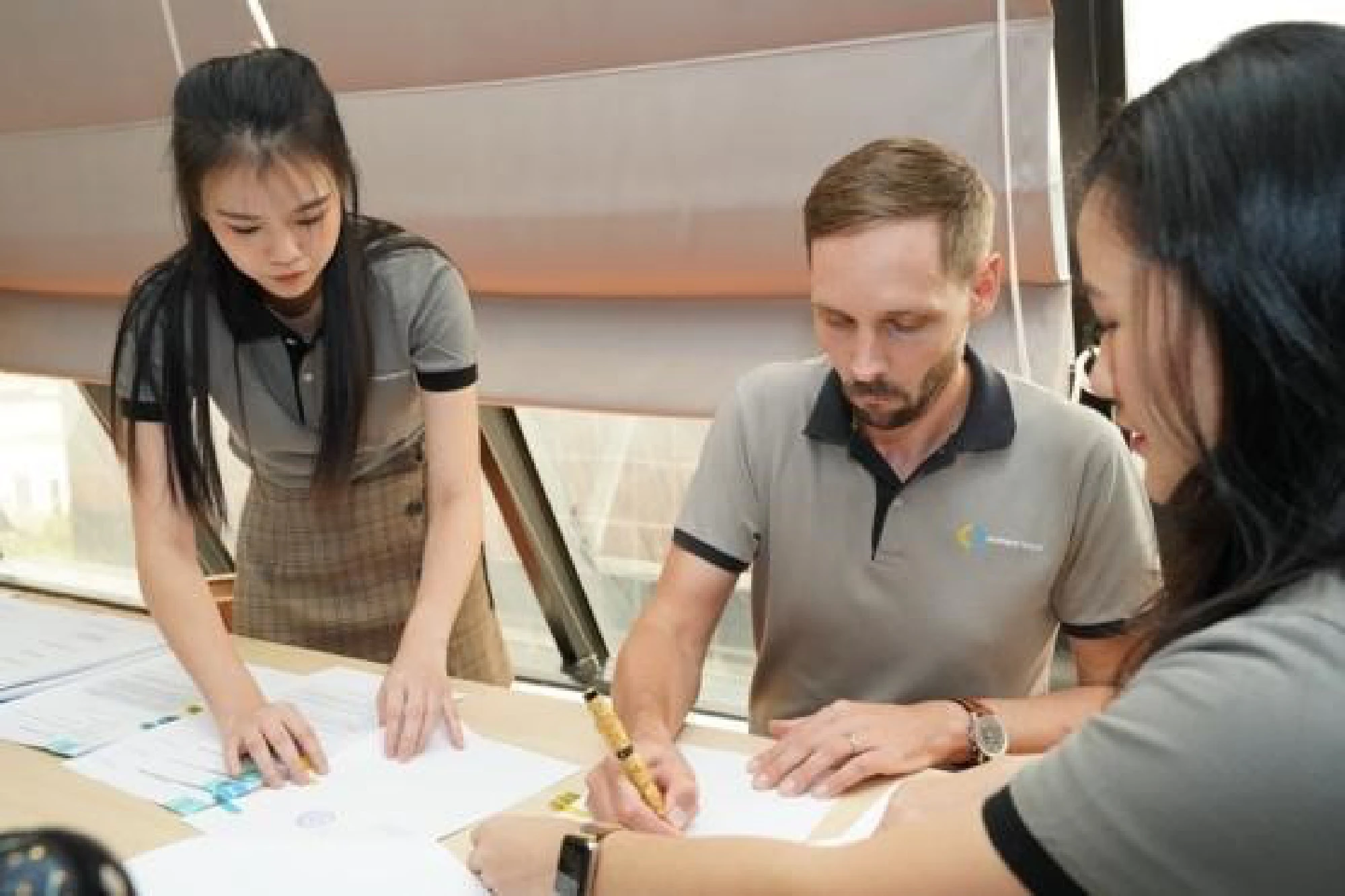 BECIS-Symbior and UOB Thailand execs sign loan documents at BECIS-Symbior’s office in Bangkok.