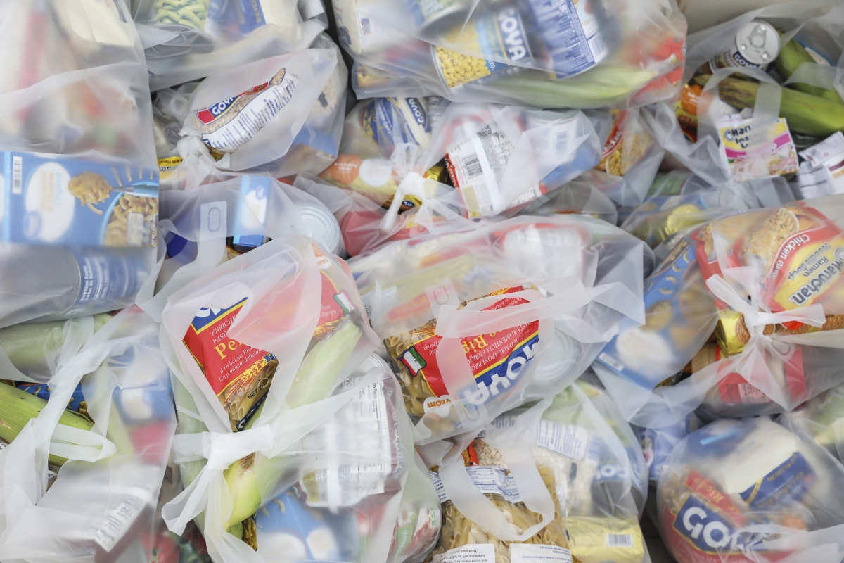 Canned and dry goods and corn were handed out at the Seasons Florida Resort in Kissimmee on Saturday. MUST CREDIT: Photo by Eve Edelheit for The Washington Post.