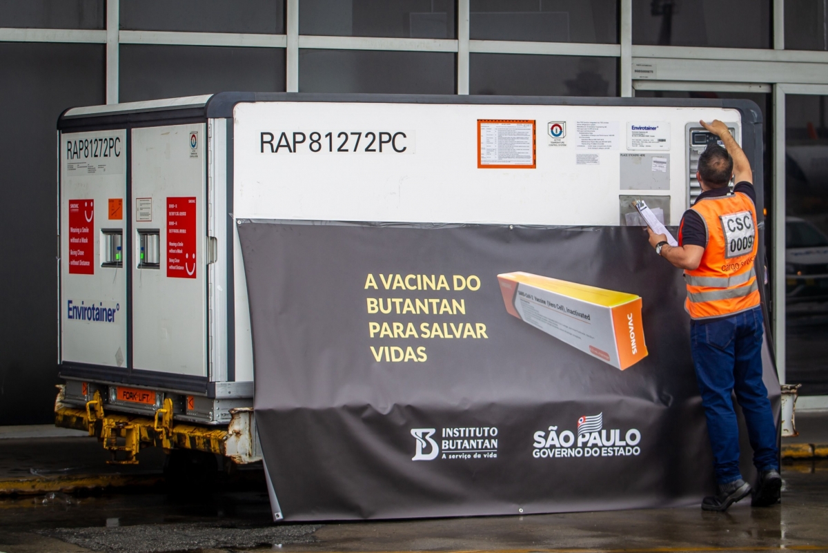 A worker checks a refrigerated container carrying Sinovac Biotech coronavirus vaccines at Guarulhos International Airport in Sao Paulo, Brazil, on Nov. 19, 2020. MUST CREDIT: Bloomberg photo by Jonne Roriz